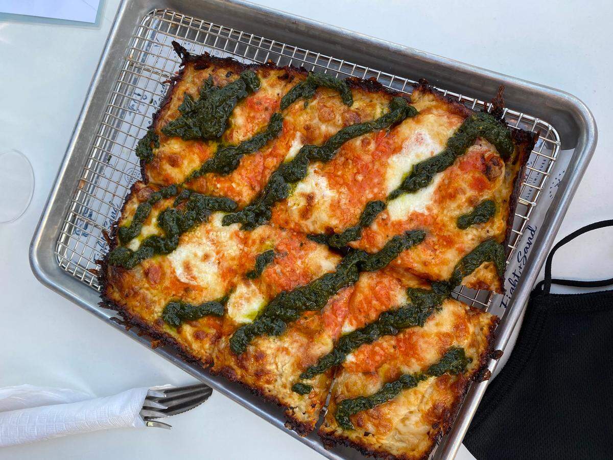 Eight + Sand ‘s Crisp Edge Vodka Pesto Pizza.