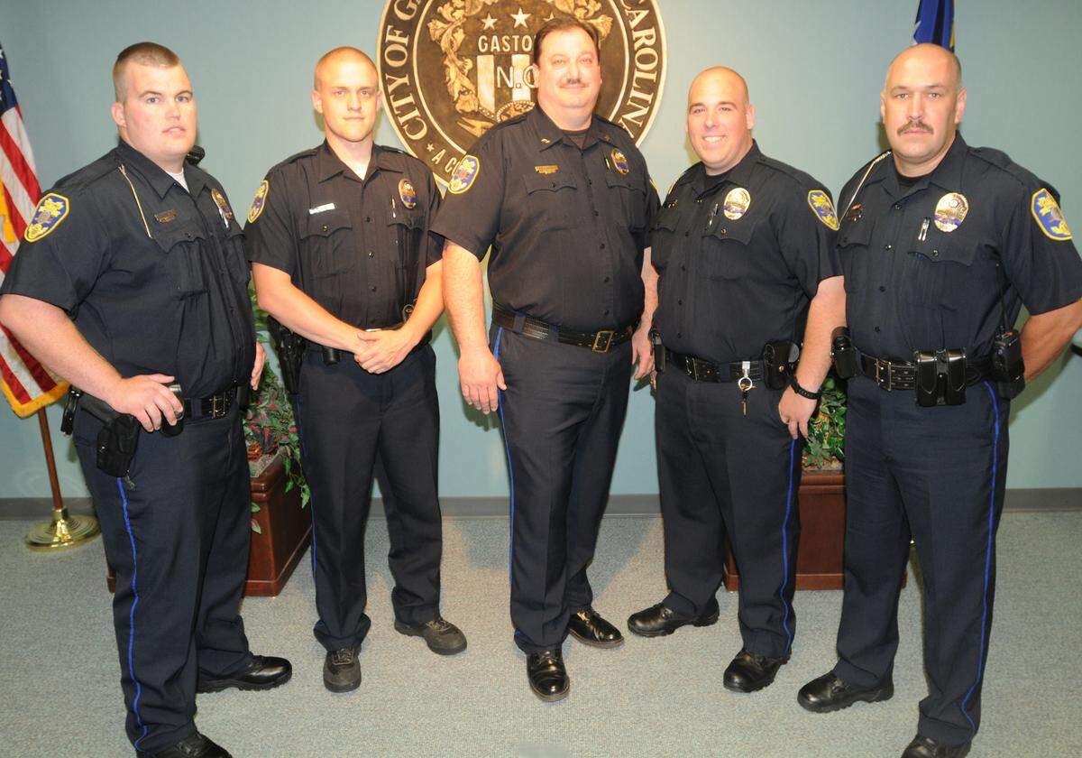 This 2012 Observer file photo shows four new Gastonia Police Department officers after they were sworn in. New officers pictured with then-Chief Stacy Conley, center, are, from left, Cody Edge, Luke Hester, Cody Huffstetler and Jason Green.
