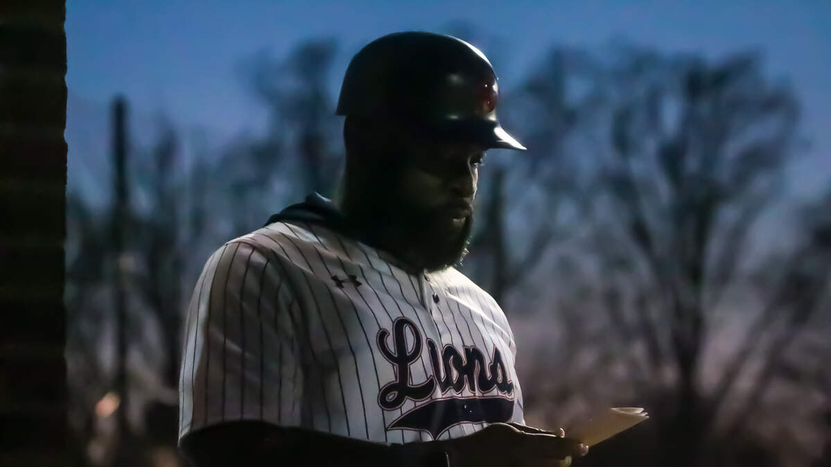 Covenant Day baseball coach David Houseton checks his lineup card during a game against Cannon School