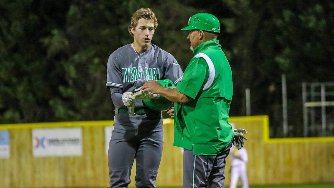 Myers Park Coach gives his player a pep talk before hitting the field