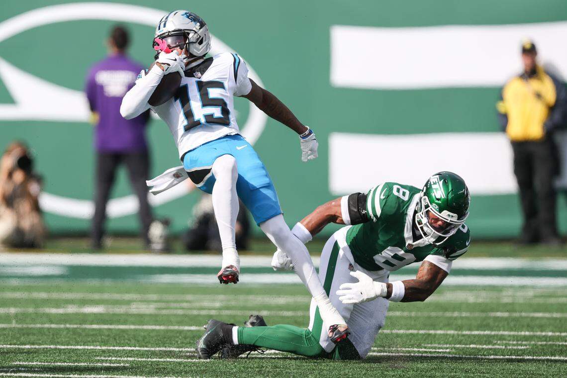 Carolina Panthers wide receiver Jimmy Horn Jr. (15) is tackled by New York Jets safety Andre Cisco (8) in the first quarter on Sunday in New Jersey.