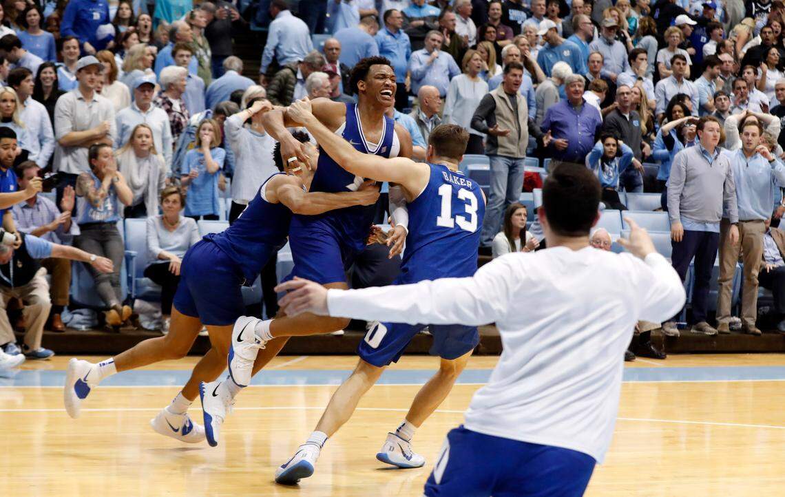 Duke’s Wendell Moore Jr. (0) celebrates after hitting the game-winning shot during Duke’s 98-96 overtime victory over UNC Saturday. Moore, a freshman from Charlotte, finished with 17 points and 10 rebounds.