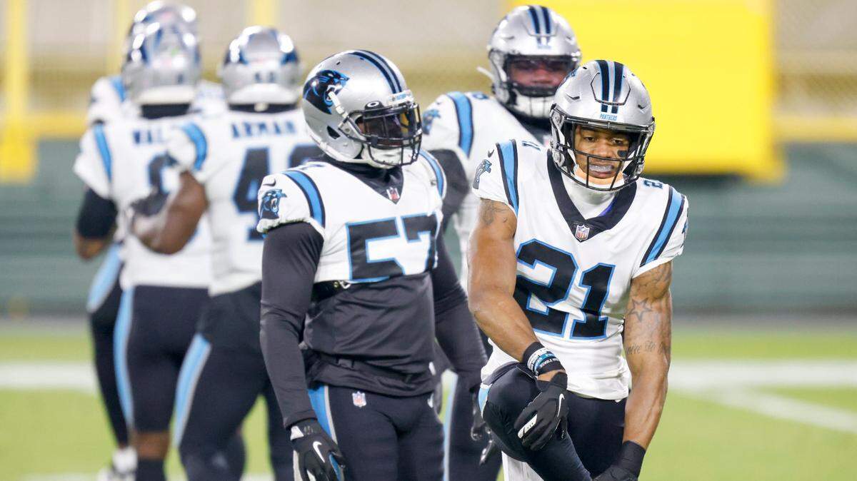 Carolina Panthers’ Jeremy Chinn (21) warms up with teaqmmates before an NFL football game against the Green Bay Packers Saturday, Dec. 19, 2020, in Green Bay, Wis. (AP Photo/Matt Ludtke)