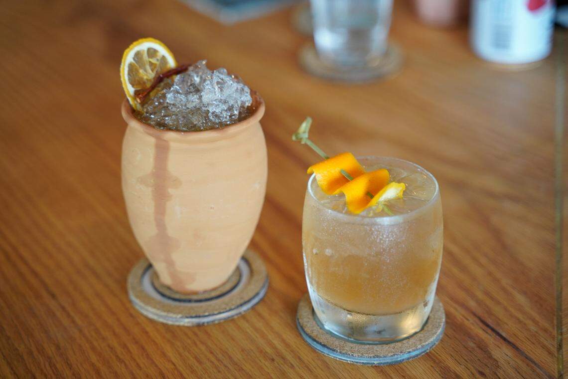 Cocktails at VANA include Agave Fields Forever, left: Los vecinos mezcal, Lunazul Reposado, strawberry agave, orange bitters and garnished with expressed orange peel; and Keeping It Spicy (in a cantarino), right: Montelobos mezcal, Campari, Passionfruit, Arbol, jalapeno peppers, ginger lime, and garnished with dehydrayed citrus wheel and an arbol pepper.