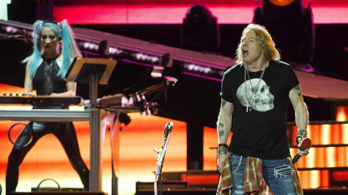 Guns N’ Roses lead vocalist Axl Rose, right, photographed during a concert in 2016 at Kansas City’s Arrowhead Stadium.