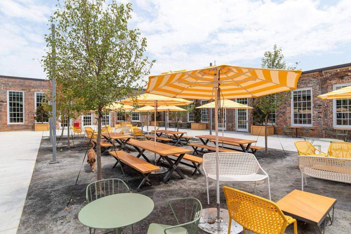 Optimist Hall’s outside patio has plenty of seating and shade options.