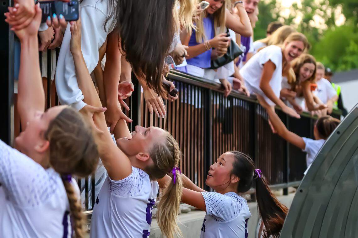 Ardrey Kell players run to the crowd to celebrate their win over Ashley with the fans at the NCHSAA 4A girls’ soccer state championship game in Matthews NC at the Sportsplex on May 31. 2025