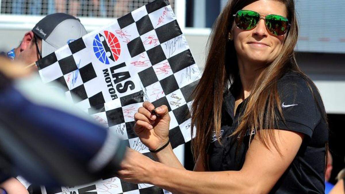 Danica Patrick signs autographs before a NASCAR Cup Series auto race Sunday, March 12, 2017, in Las Vegas.
