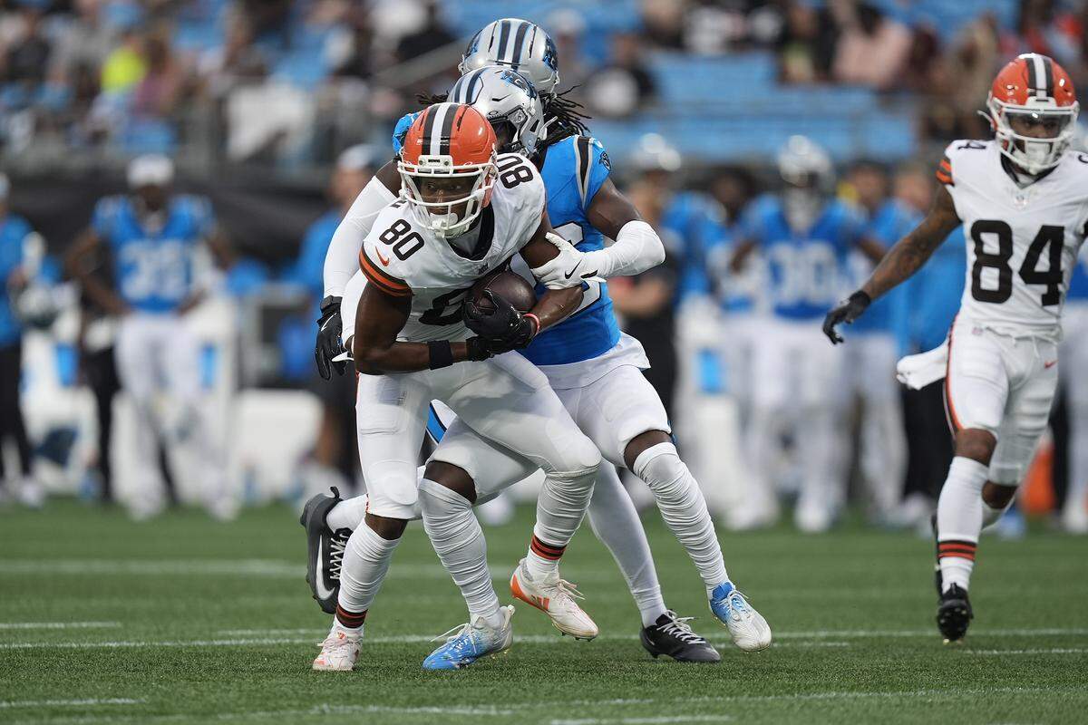Cleveland Browns wide receiver Jamari Thrash (80) is tackled after the completion by Carolina Panthers safety Demani Richardson (36) during Friday’s first quarter at Bank of America Stadium. 