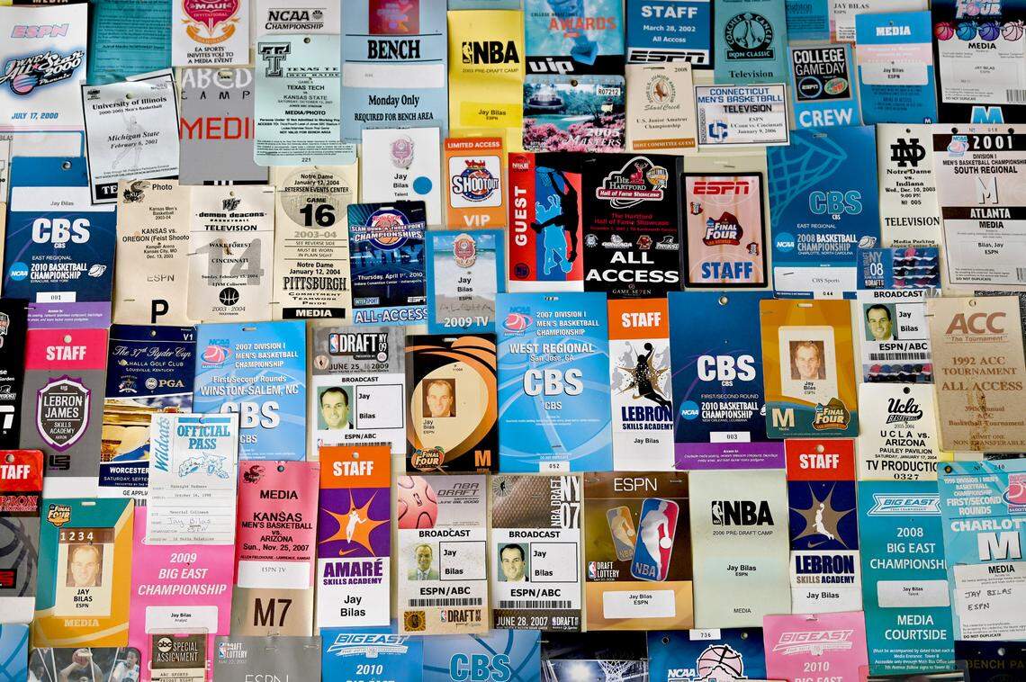 Press credentials cover a garage wall in the garage of ESPN college basketball analyst Jay Bilas’ Charlotte, NC home.