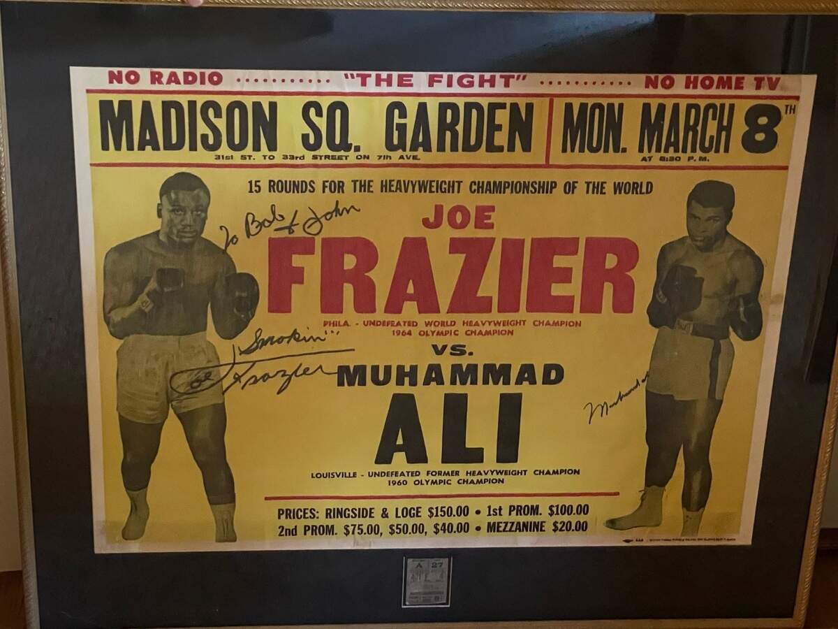 On March 8, 1971, Muhammad Ali and Joe Frazier faced off for the world heavyweight championship in New York. John Allbert, then 11 years old and a future Charlotte doctor, persuaded his father to take him to the fight and, 30 years later, got the poster signed by both fighters.