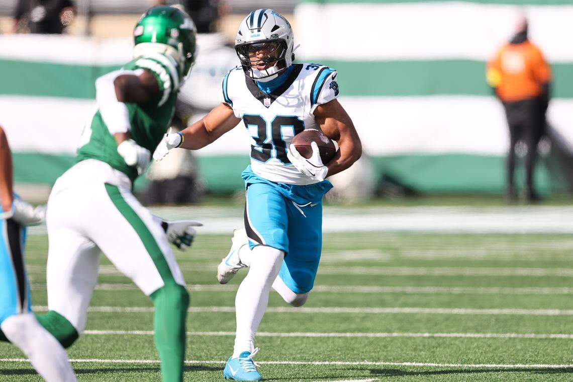 Carolina Panthers running back Chuba Hubbard (30) runs with the ball in the second quarter against the New York Jets on Sunday in New Jersey.