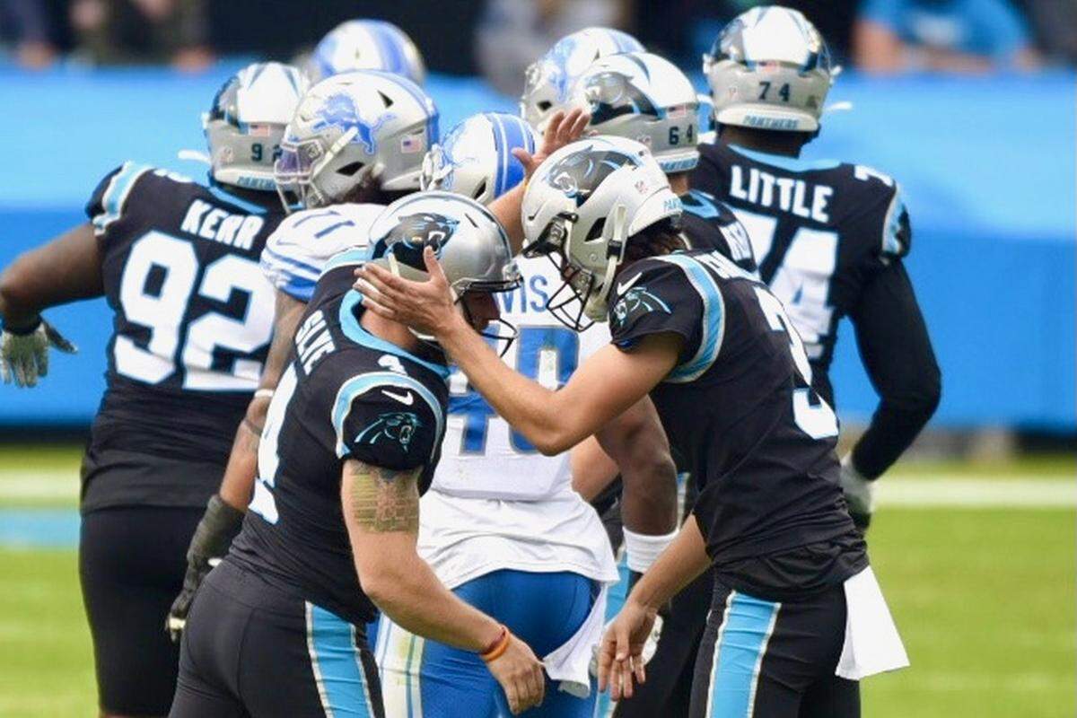 Panthers kicker Joey Slye, left and punter Joseph Charlton, right celebrate Slye’s 56-yard field goal against Detroit during third quarter action against Detroit, Sunday November 22, 2020.
