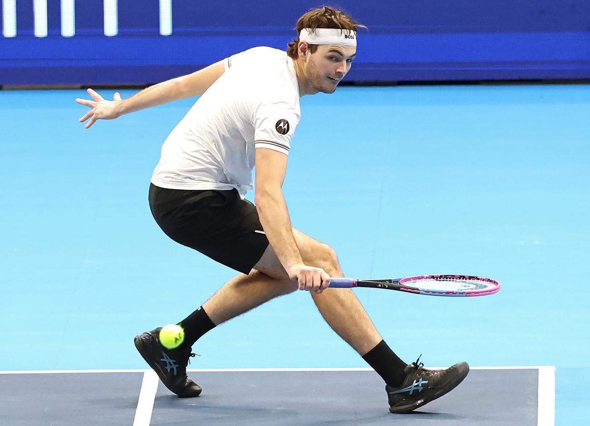 Taylor Fritz, currently the top American tennis player, concentrates on the ball as he slices a backhand Thursday.