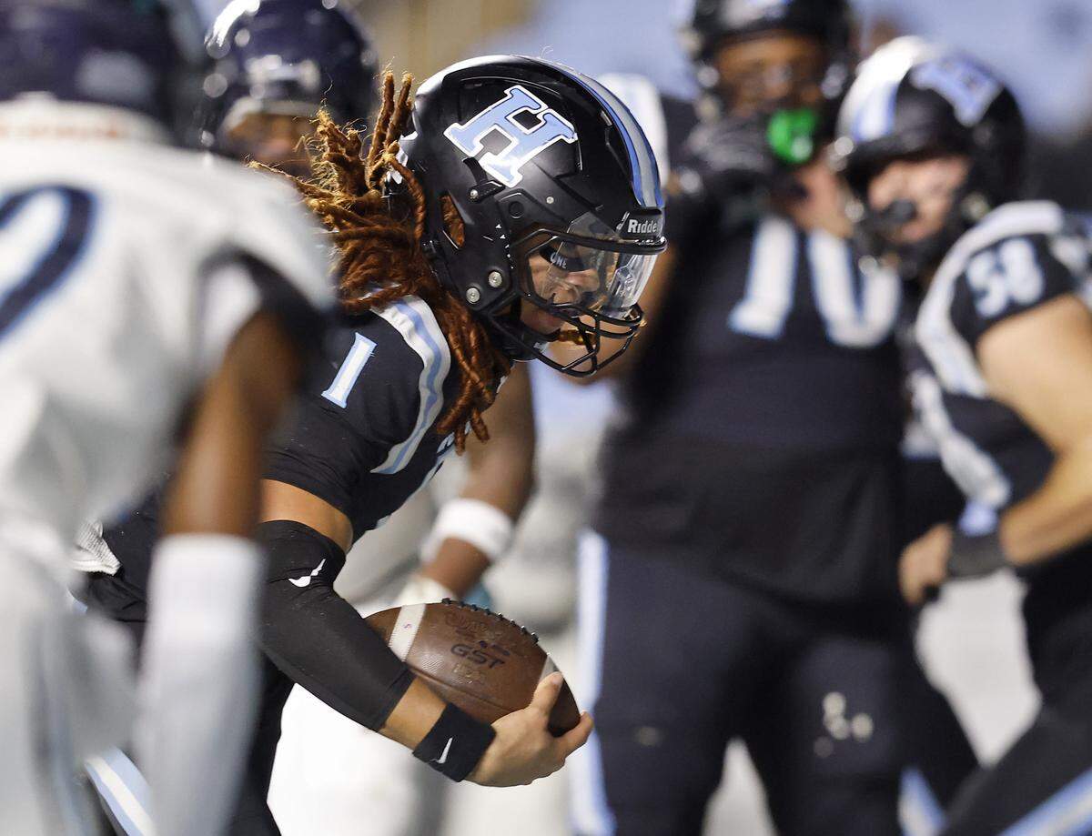 Hough’s Ethan Royal runs the ball into the end zone to score a touchdown during the first half of the NCHSAA 8A high school football state final against Millbrook on Thursday, Dec. 11, 2025, at Kenan Stadium in Chapel Hill, N.C. 