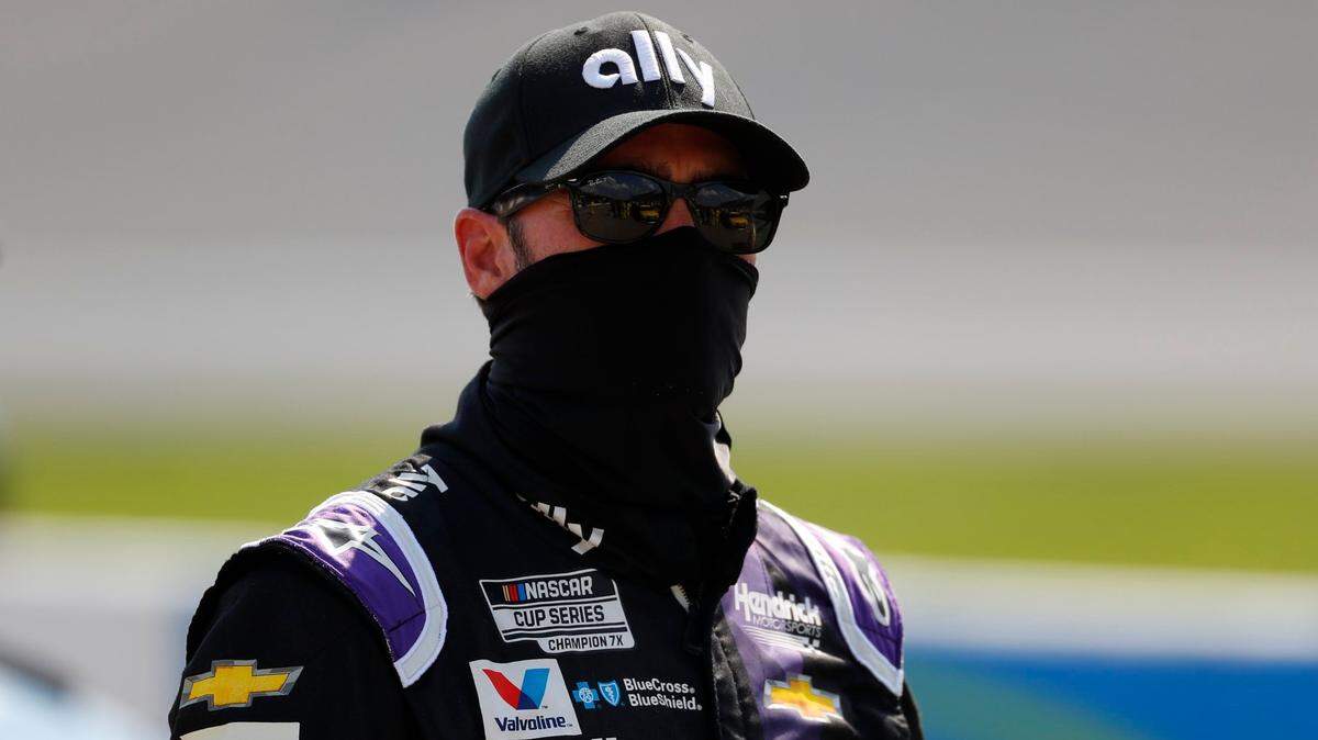 Jimmie Johnson prepares before a NASCAR Cup Series auto race at Michigan International Speedway in Brooklyn, Mich., Sunday, Aug. 9, 2020. (AP Photo/Paul Sancya)