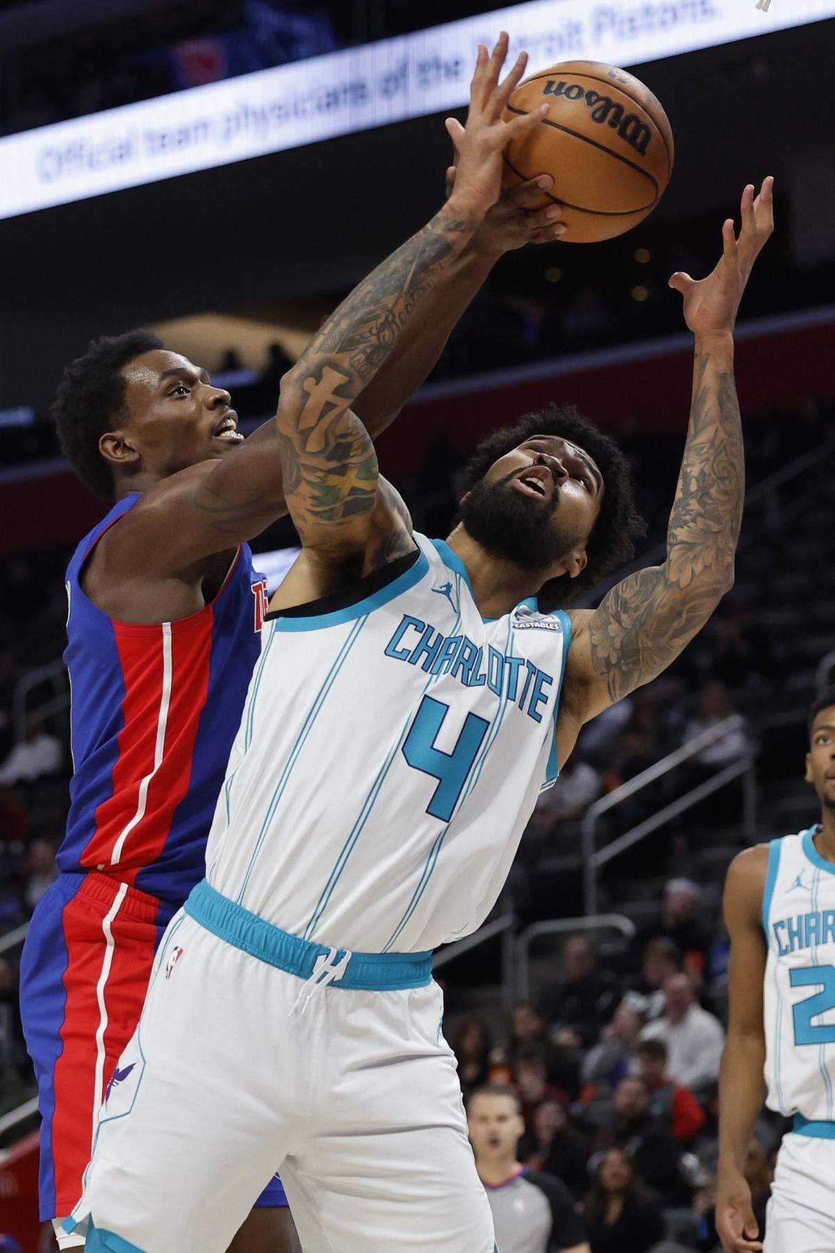 Detroit Pistons center Jalen Duren (0) and Charlotte Hornets center Nick Richards (4) go for the rebound in the first half at Little Caesars Arena.