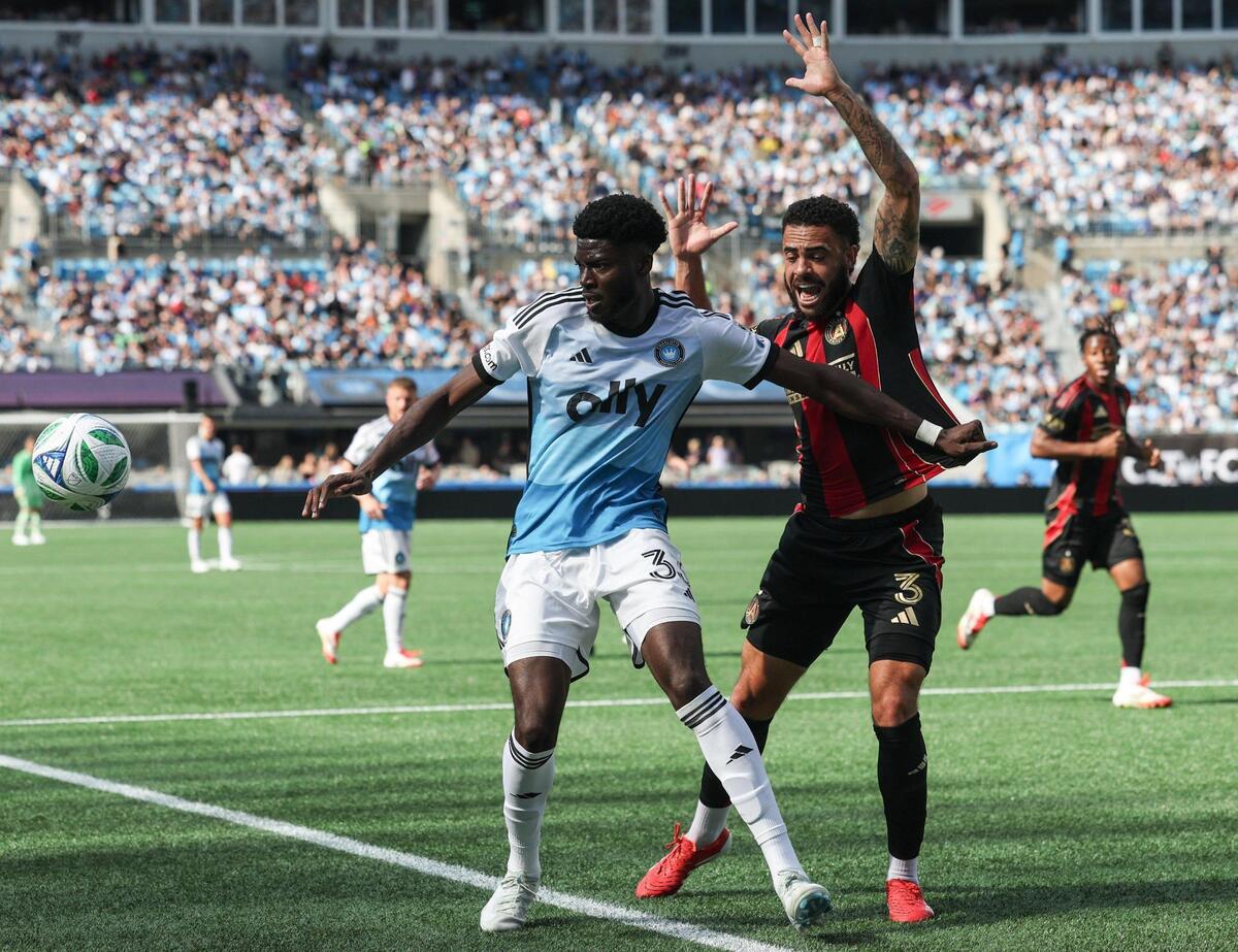 Atlanta United’s Derrick Williams, right, flails when Charlotte FC’s Timothy Ream, right, tries to get the ball uring the match at Bank of America Stadium in Charlotte, NC on Saturday, March 1, 2025.