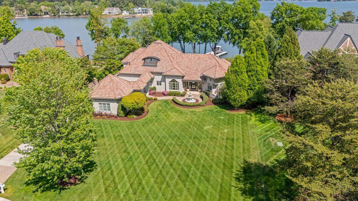 Trump International Realty is selling the Lake Norman waterfront mansion of a former Carolina Panther linebacker for $7.5 million.
