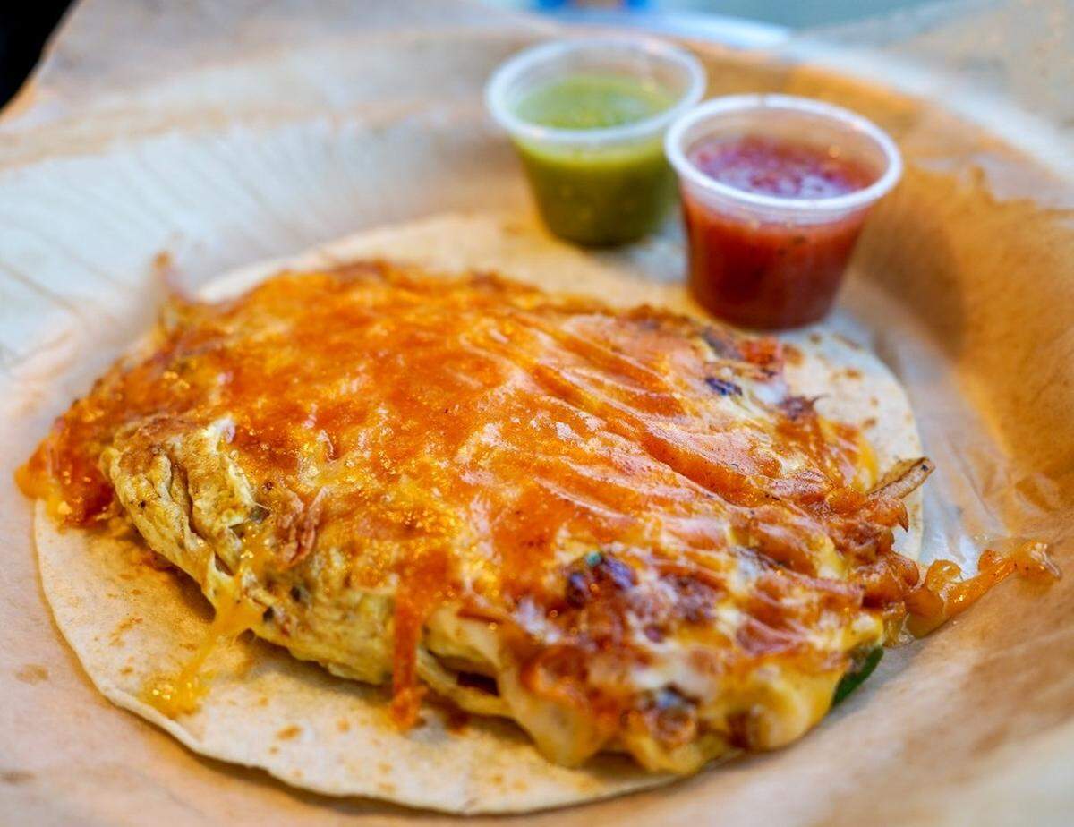 The Migas taco from Taco Billy made withe eggs, onions, jalapeños, tomatoes, crispy-fried tortilla strips, and cheddar jack cheese.