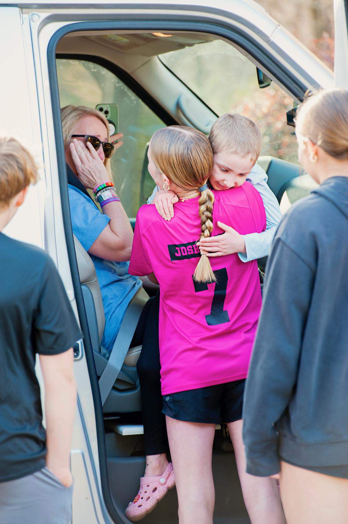 Annie Smith is welcomed home by family members in the driveway after returning from St. Jude Children’s Research Hospital last month.