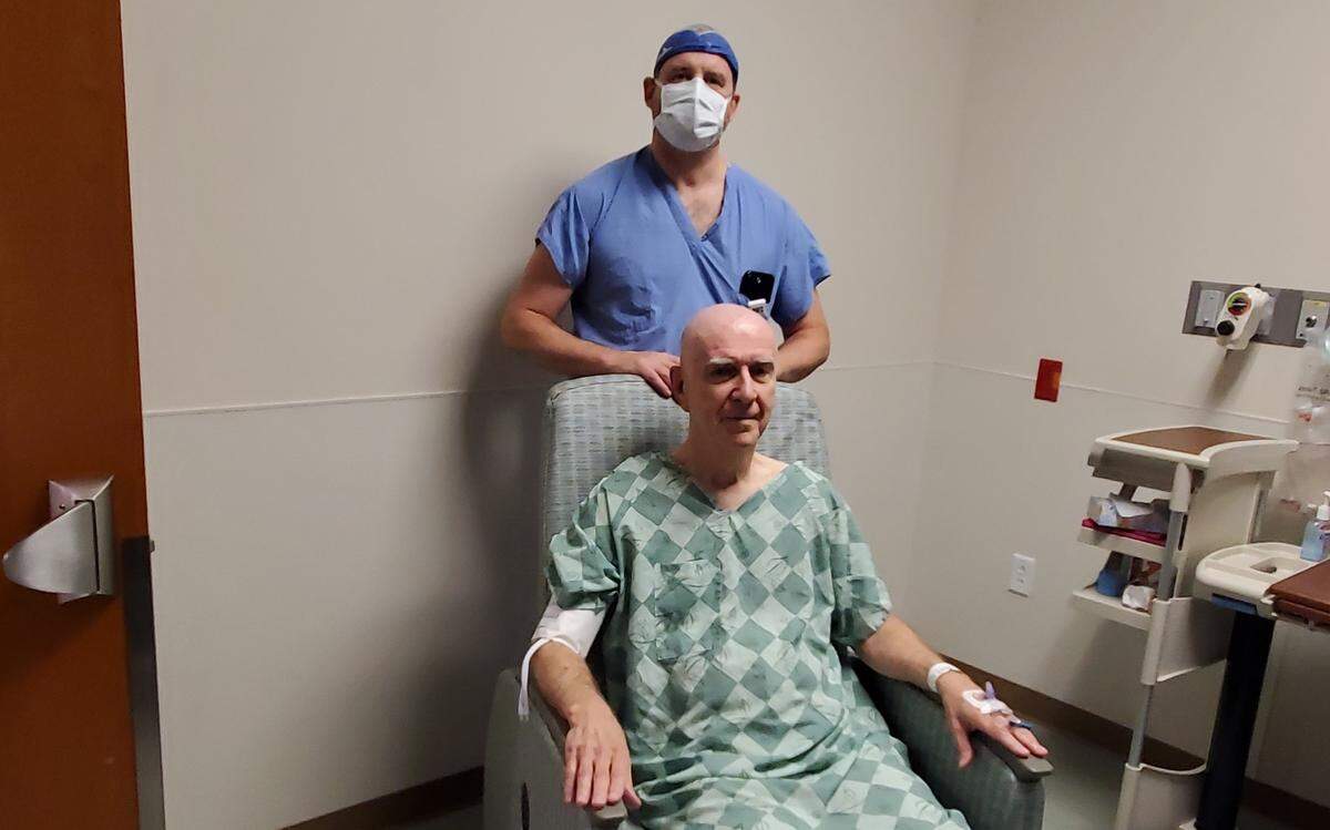 Dr. Charles Munyon, a functional neurosurgeon, performed an incision-free brain operation on Luther “Larry” Hicks to help relieve him of tremors.