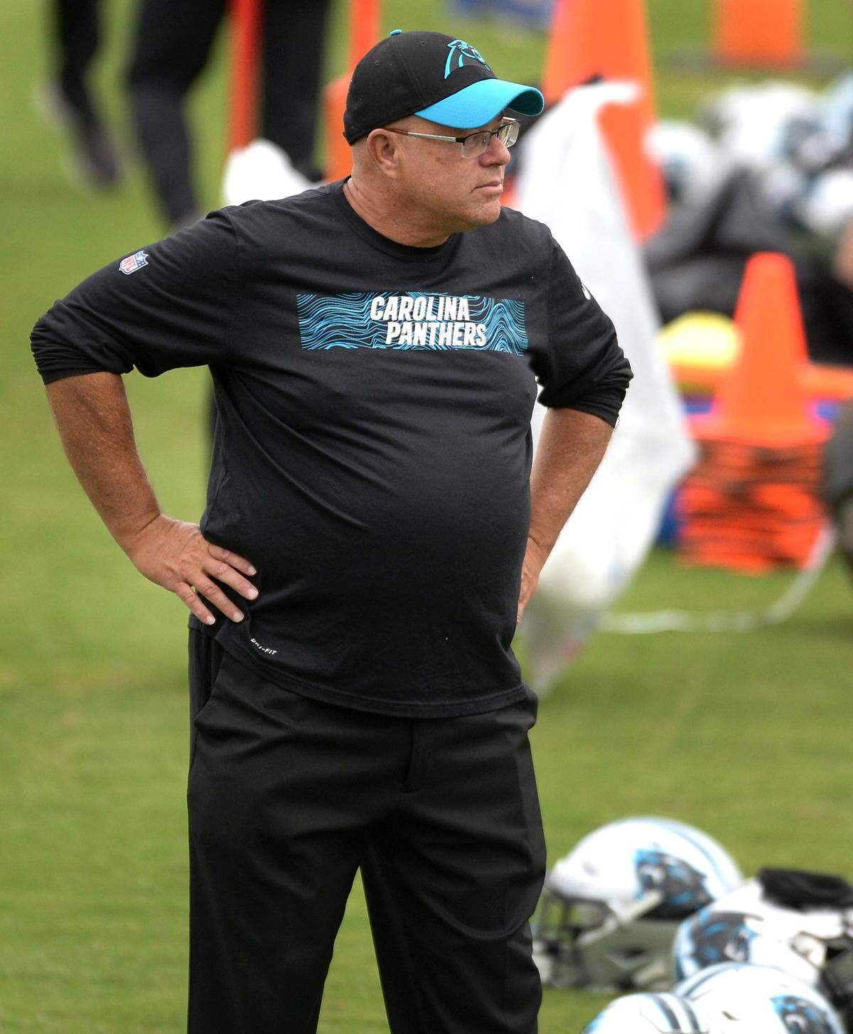 Carolina Panthers team owner David Tepper watches the players stretch to begin practice on Wednesday, June 12, 2019.