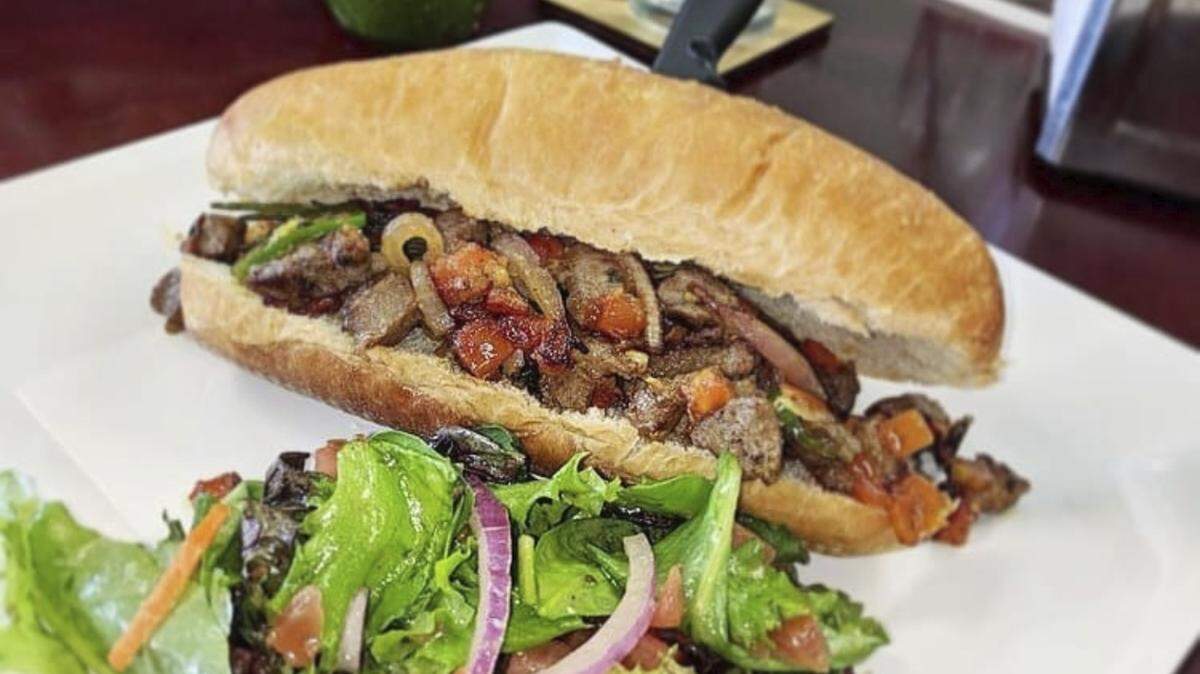 Enat in Charlotte puts traditional Ethiopian tibs, a rich meat-and-gravy dish, on an American hoagie roll.