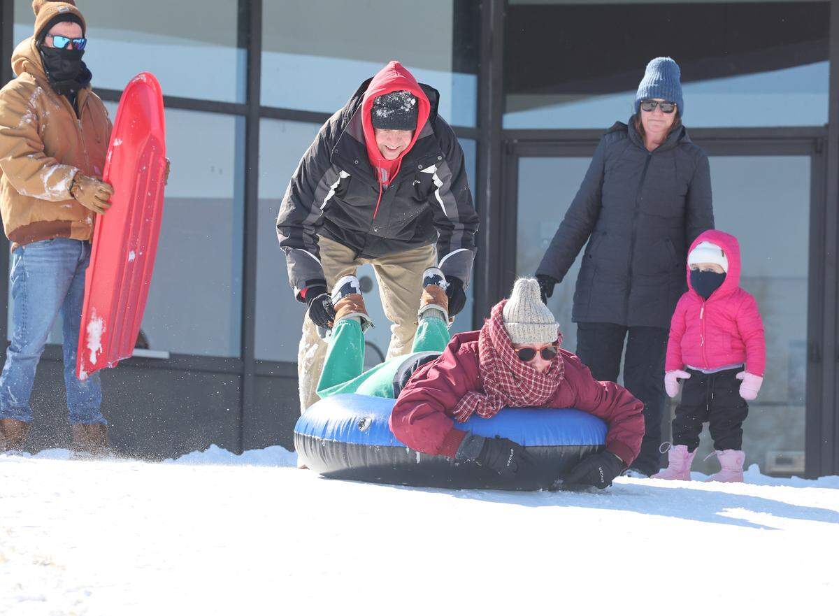 Sledders in Rock Hill, S.C. prepare to fly down a hill at the Winthrop Coliseum Sunday, Feb. 1, 2026.