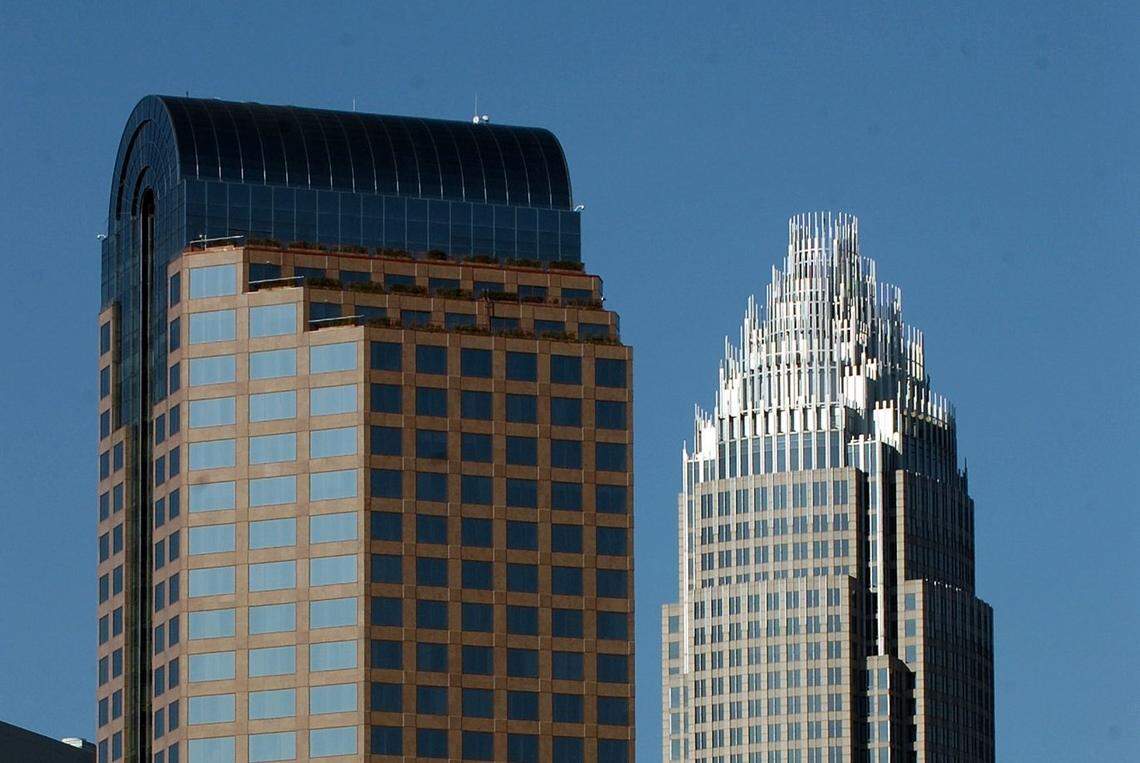 Wells Fargo and Bank of America both halted political donations after the riot at the U.S. Capitol in early January. One Wells Fargo Center (left) and the Bank of America Corporate Center (right) in Uptown Charlotte.