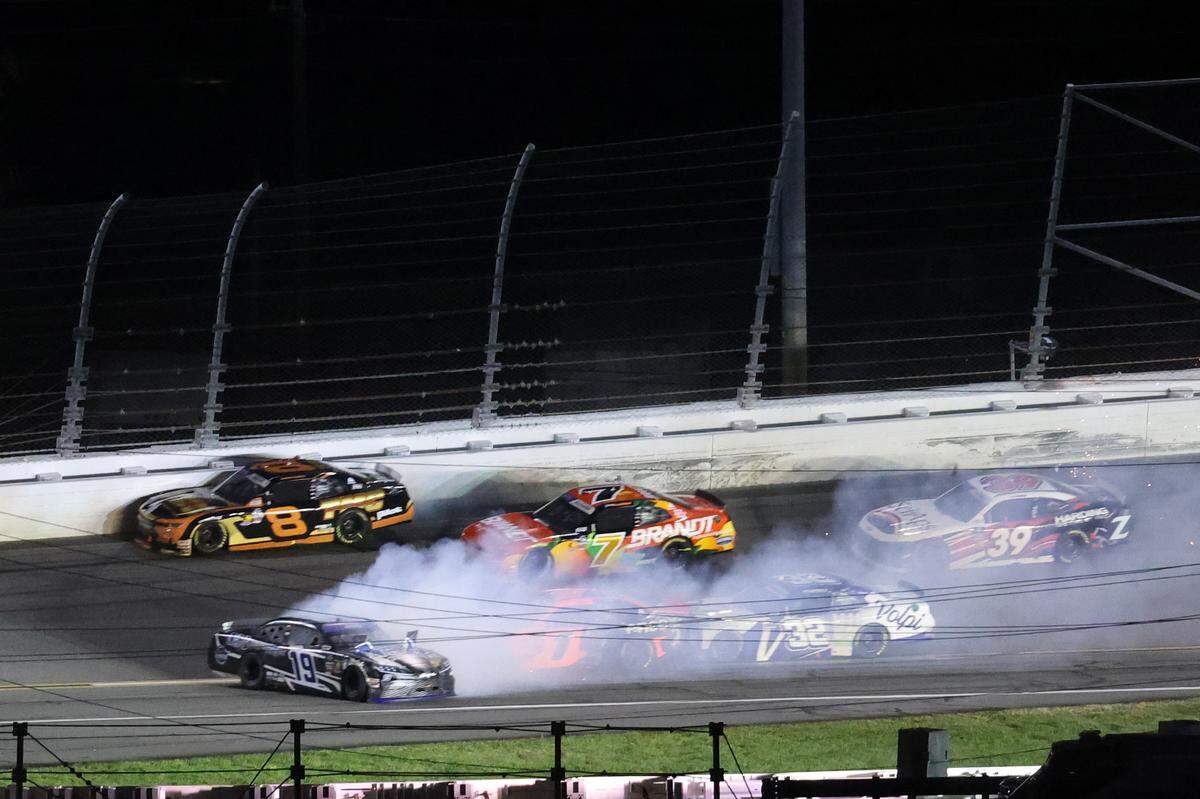 Feb 15, 2025; Daytona Beach, Florida, USA; Xfinity Series driver Carson Kvapil (1) crashes into driver Justin Bonsignore (19) during the United Rentals 300 at Daytona International Speedway. Mandatory Credit: Mark J. Rebilas-Imagn Images