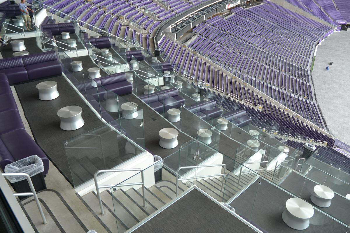 Instead of traditional seats, some club members at U.S. Bank Stadium sit on couches that resemble a night club.