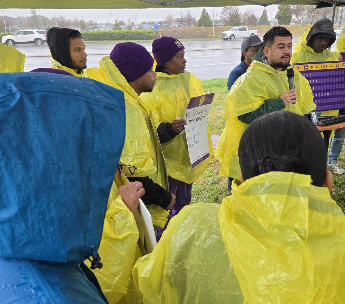 Charlotte Councilman JD Mazuera Arias shows support to airport workers asking for more pay and better benefits.