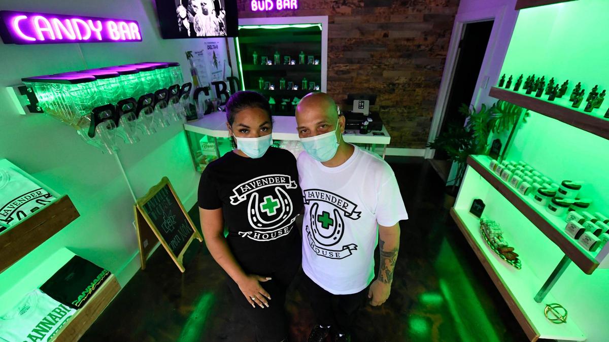 Lavender House owners Lindsey Smith, and Freddy Rosa stand in their CBD dispensary Monday in Charlotte. They make their own products, such as edibles, CBD oil, bath products and pain relief gels.