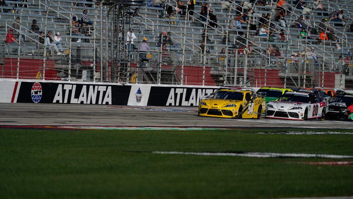 FILE - Martin Truex Jr. leads during a NASCAR Xfinity Series at Atlanta Motor Speedway in Hampton, Ga., in this Saturday, March 20, 2021, file photo. After putting off the inevitable project as long as possible, Atlanta Motor Speedway officials announced plans to resurface the worn-out track following Sunday’s NASCAR race. (AP Photo/Brynn Anderson, File)