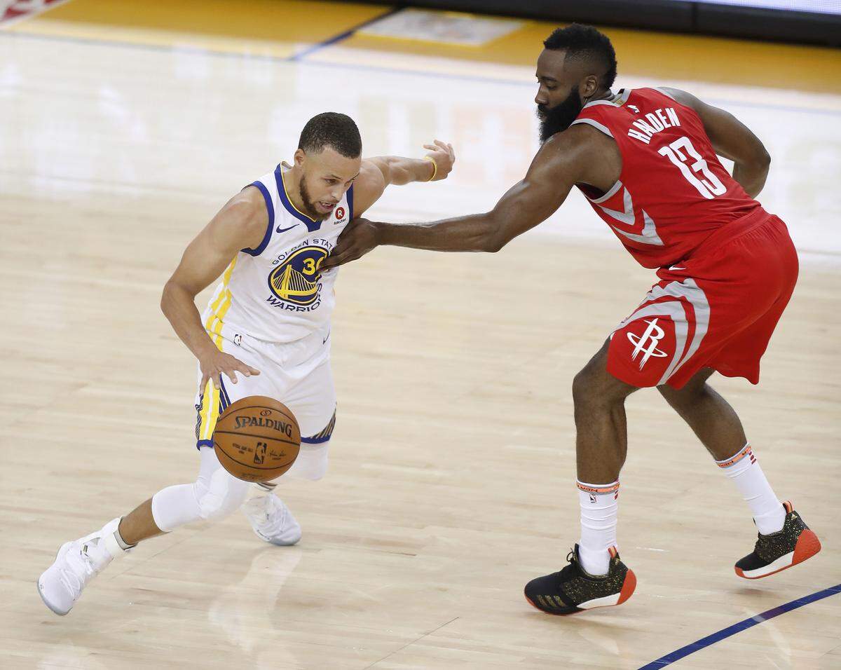 Golden State's Stephen Curry (30) dribbles against Houston's James Harden (13) in the fourth quarter of Game 3 of the NBA Western Conference finals on Sunday at Oracle Arena in Oakland, Calif. Davidson coach Bob McKillop wonders why so few people talk about Harden playing poor defense and so many accuse Curry of the same.