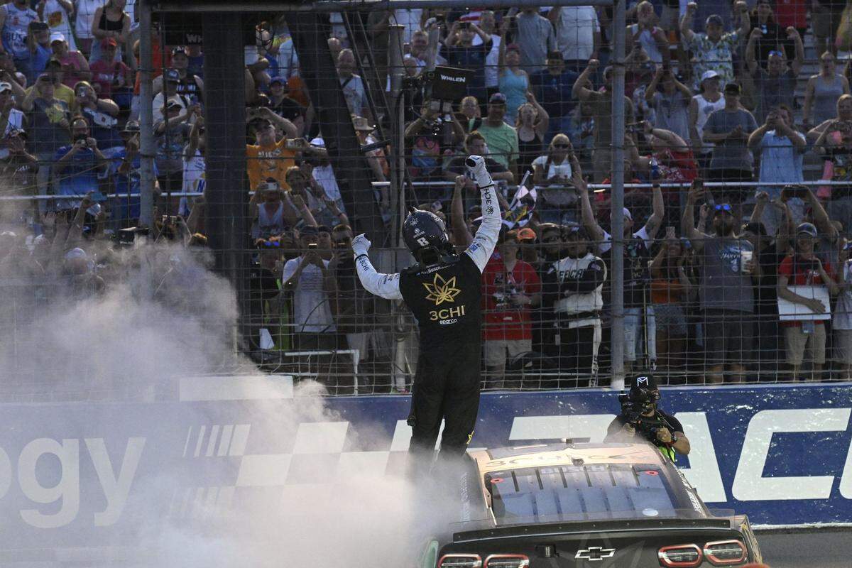 Jun 4, 2023; Madison, Illinois, USA; NASCAR Cup Series driver Kyle Busch (8) reacts to fans after winning the Enjoy Illinois 300 at World Wide Technology Raceway. Mandatory Credit: Joe Puetz-USA TODAY Sports