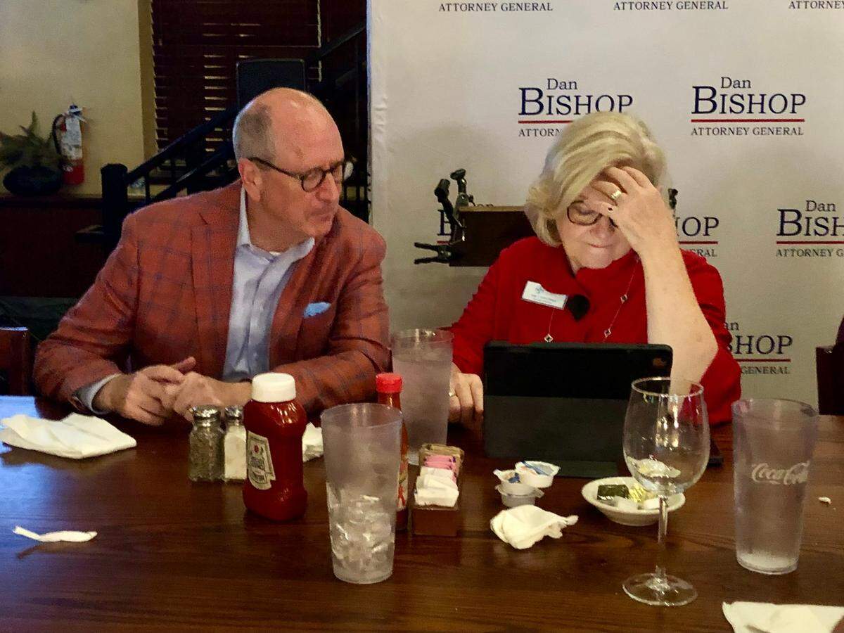 Congressman Dan Bishop , left, looks over election results with Tami L. Fitzgerald, executive director NC Values right, during a watch party at Spiro’s Hilltop Fish Fare and Steakhouse in Monroe, NC on Tuesday, November 5, 2024.