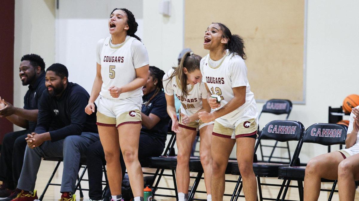 Cannon’s Kierra Morrow (5) and Khloe Thompson (12) celebrate a basket made by a teammate during the game against Country Day on Thursday, January 11, 2024. Cannon defeated Country Day 65-45.