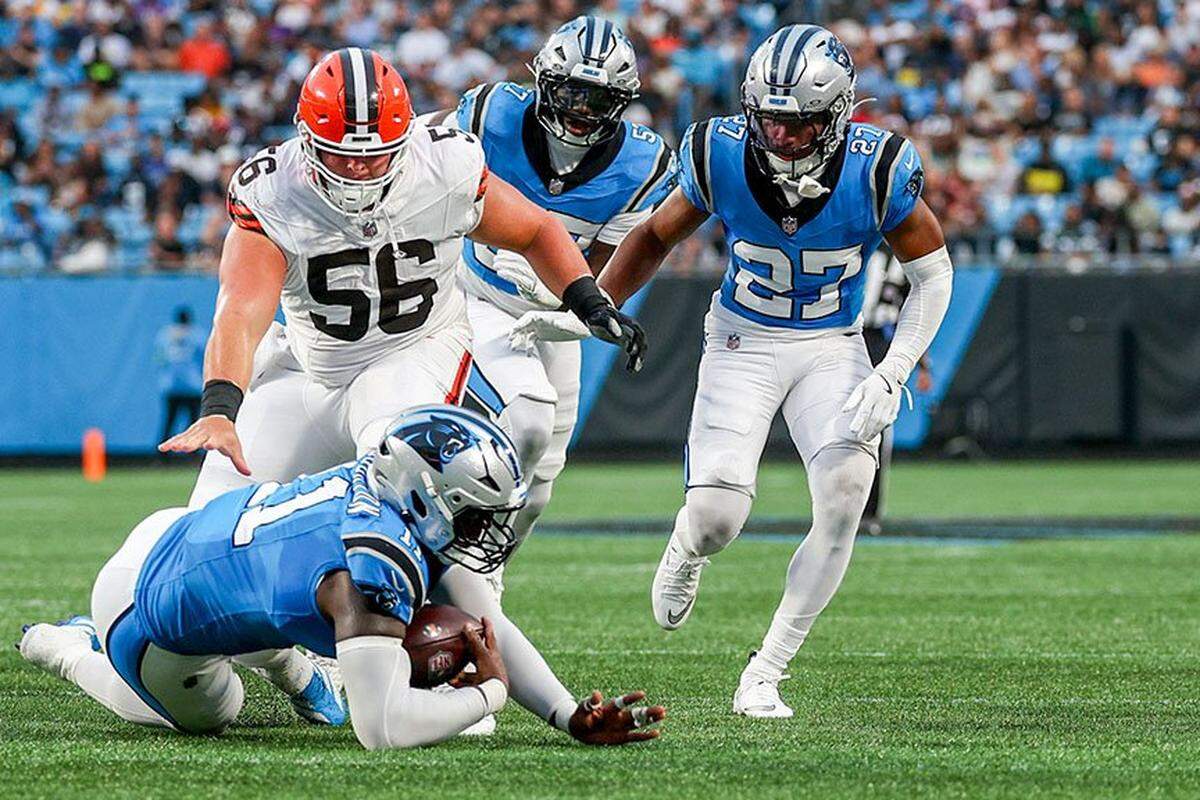 Carolina Panthers outside linebacker Nic Scourton secures a loose ball during the Panthers’ preseason game against the Cleveland Browns at Bank of America Stadium on Friday in Charlotte.