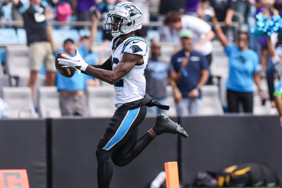 Panthers safety Sam Franklin, Jr. runs the ball into the end zone for a pick six during the game against Minnesota at Bank of America Stadium on Sunday, October 1, 2023 in Charlotte, NC.
