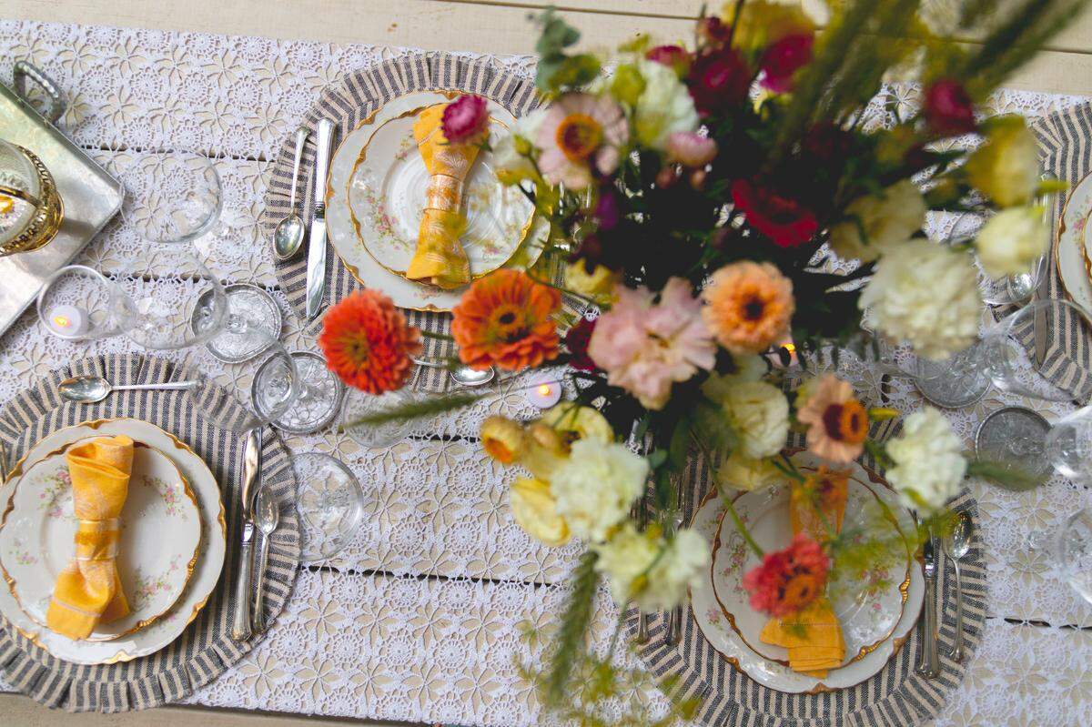 Dinners at The Finicky Table will pair the rusticity of the woods with the contrasting delicacy of antique gold-trimmed china and hammered aluminum silverware.