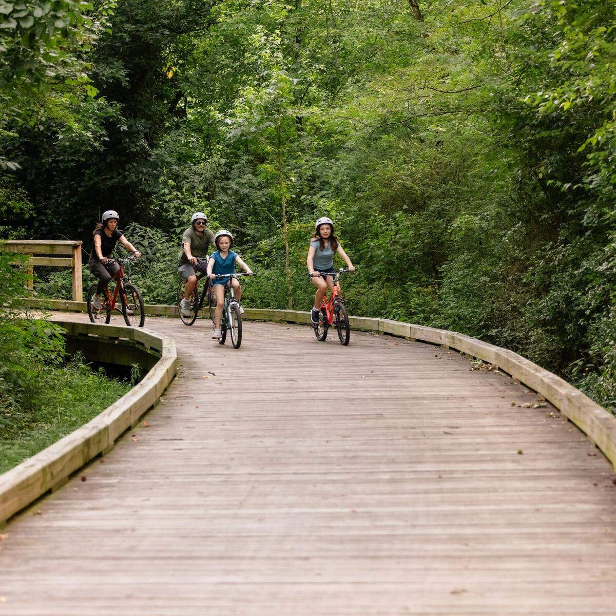 Bikers enjoy the 2.6-mile Caldwell Station Creek Greenway in Cornelius, NC.