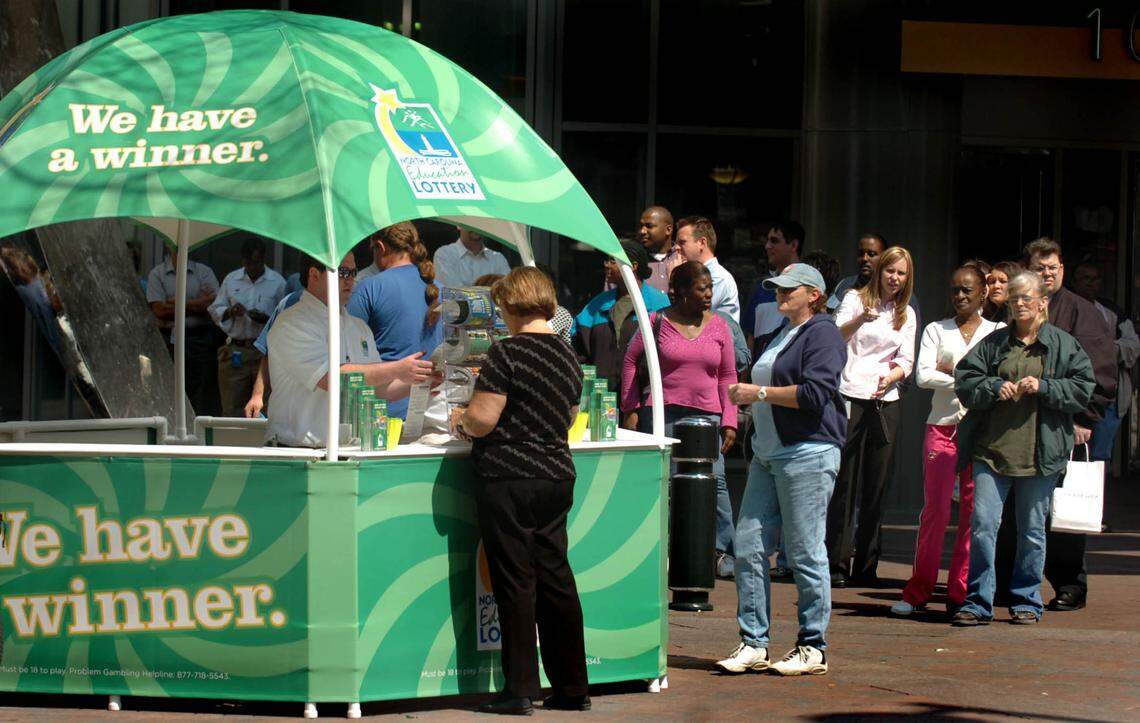 People line up to buy lottery tickets in uptown Charlotte on March 30, 2006 for the start of the North Carolina Education Lottery.