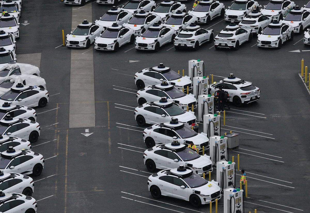 SAN FRANCISCO, CALIFORNIA - JUNE 10: In an aerial view, Waymo cars are seen parked at a Waymo facility on June 10, 2025 in San Francisco, California. Robo-taxi company Waymo has limited service in San Francisco after several Waymo cars were set on fire and destroyed during the anti-immigration protests in Los Angeles over the past week. (Photo by Justin Sullivan/Getty Images)