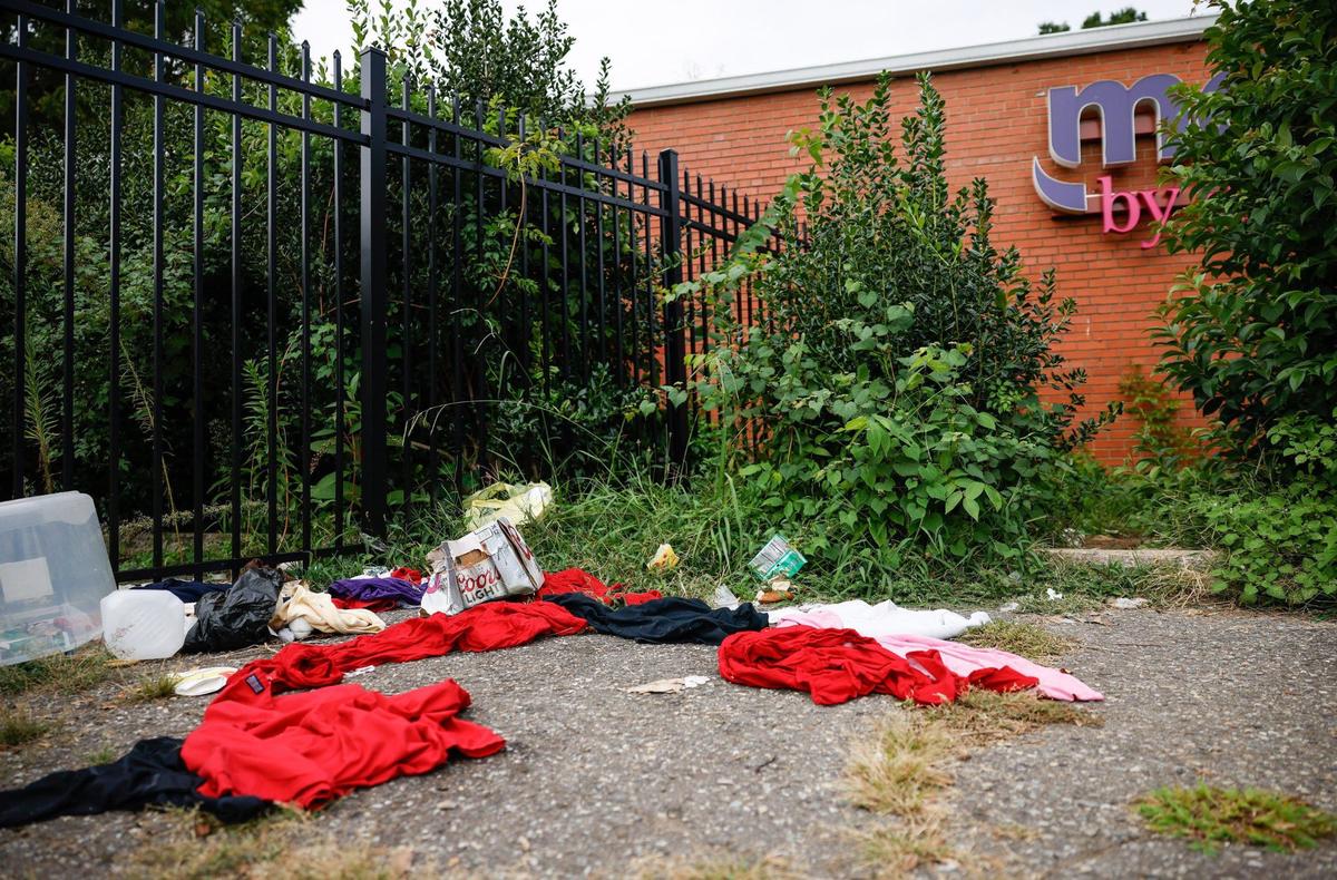 Trash and discarded clothes are littered around a vacant building at 600 Eastway Drive in Charlotte on Wednesday, September 4, 2024.