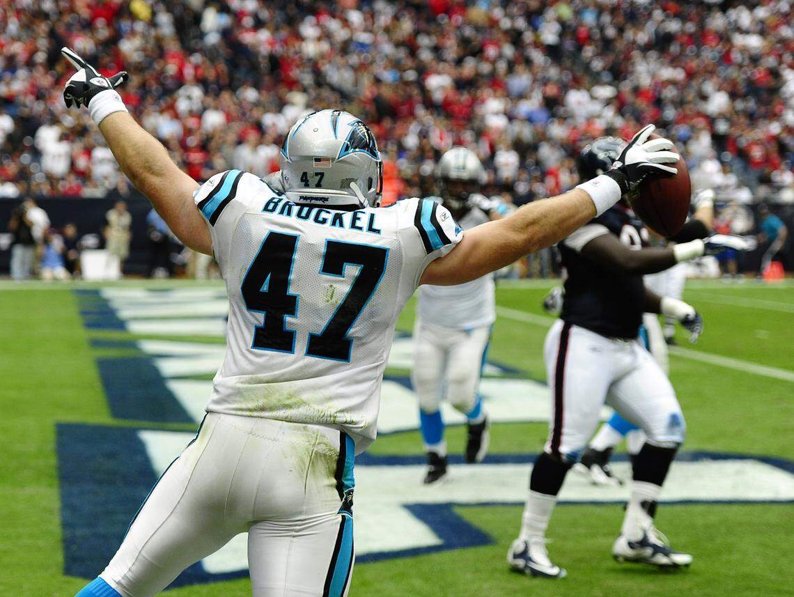 Carolina Panthers fullback Richie Brockel (47) celebrates his touchdown run against Houston in 2011. Brockel was the beneficiary of one of the greatest trick plays in Panthers history, commonly known as “The Annexation of Puerto Rico” due to its resemblance to a play run in the pee wee football comedy “Little Giants.”
