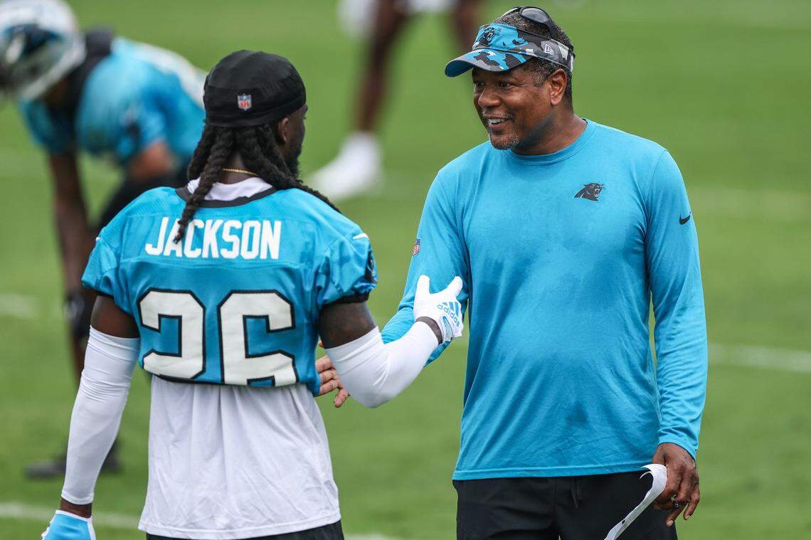 Panthers cornerback Donte Jackson, left, speaks with Defensive Pass Game Coordinator Steve Wilks during the Back Together practice in Gibbs Stadium at Wofford College on Saturday, July 30, 2022 in Spartanburg, SC.