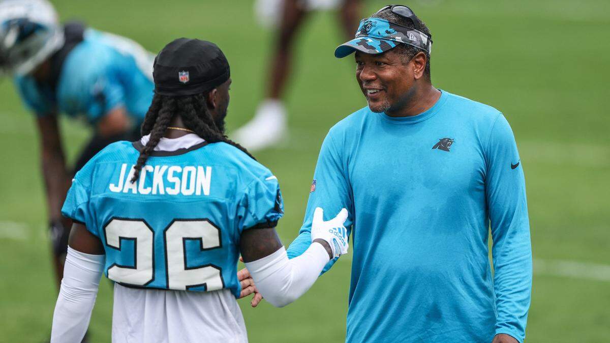 Panthers cornerback Donte Jackson, left, speaks with Defensive Pass Game Coordinator Steve Wilks during the Back Together practice in Gibbs Stadium at Wofford College on Saturday, July 30, 2022 in Spartanburg, SC.