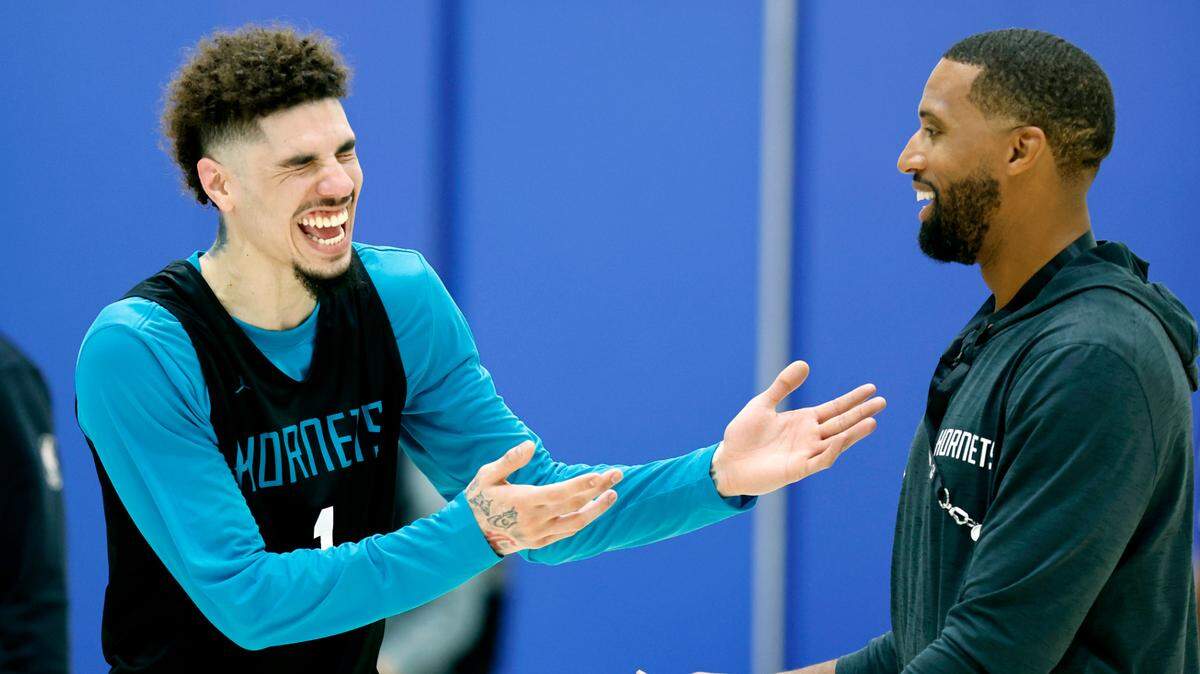 Charlotte Hornets’ LaMelo Ball (1) laughs with head coach Charles Lee after Charlotte’s practice at the Michael W. Krzyzewski Center at Duke University in Durham, N.C., Tuesday, Oct. 1, 2024.